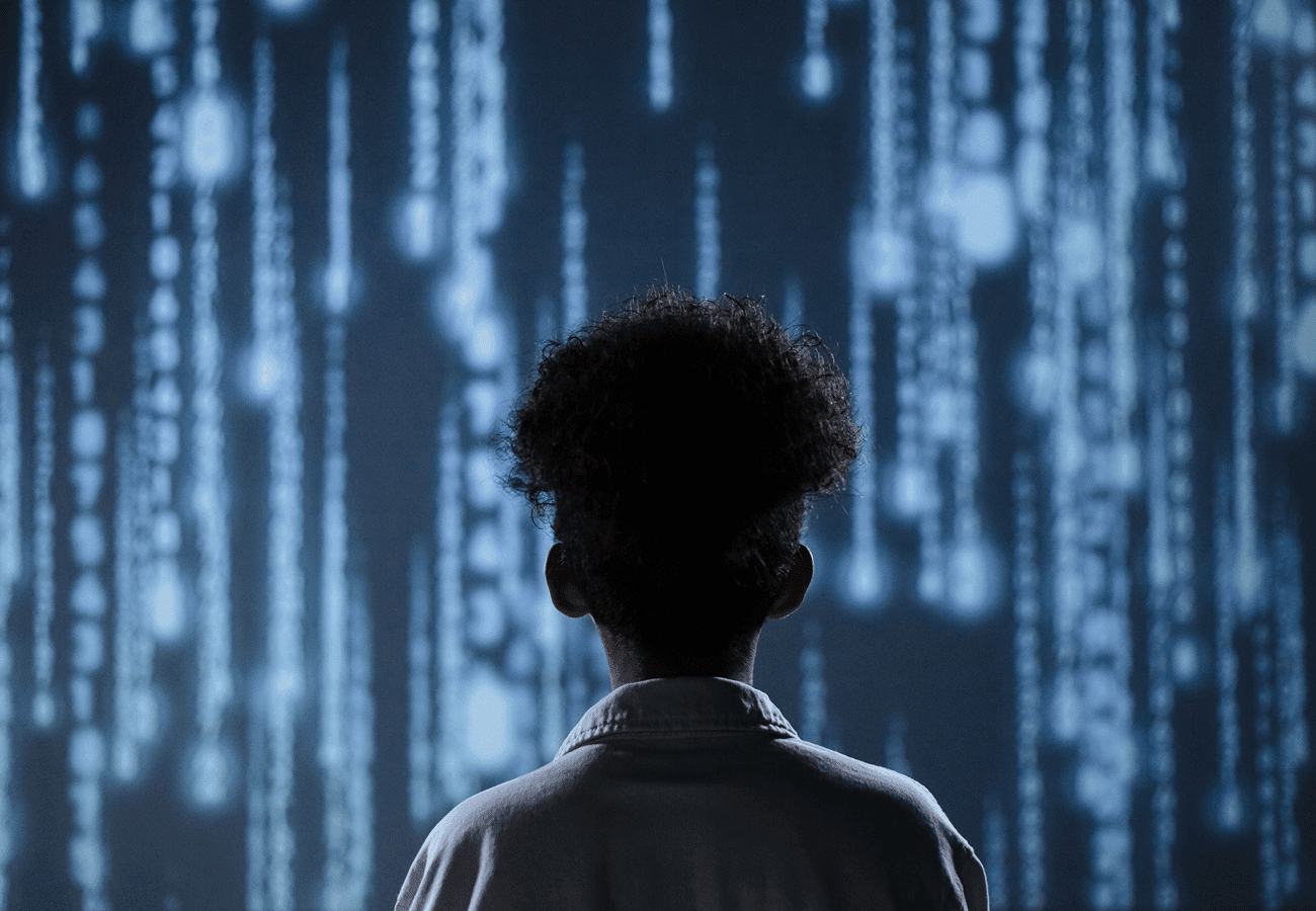 Person looking at cascading digital data streams.