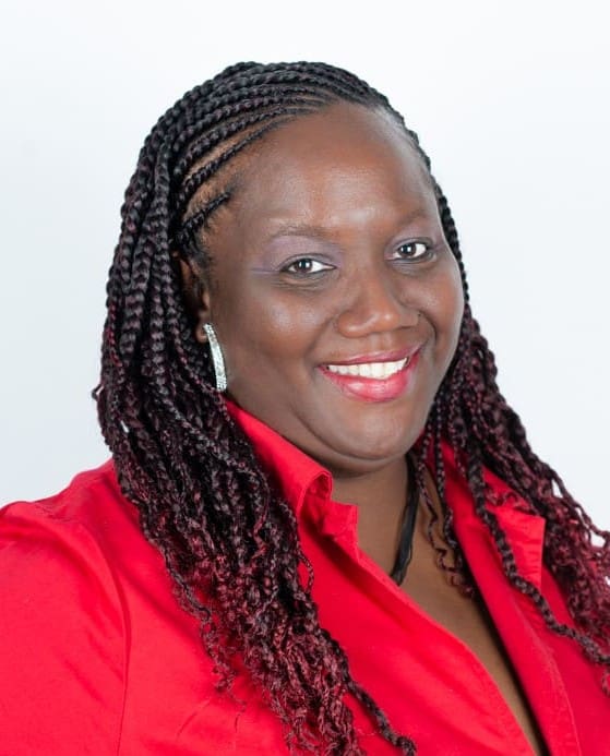 Smiling woman with braided hair in red blouse