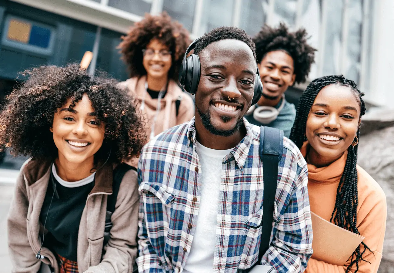 Smiling young adults with headphones.