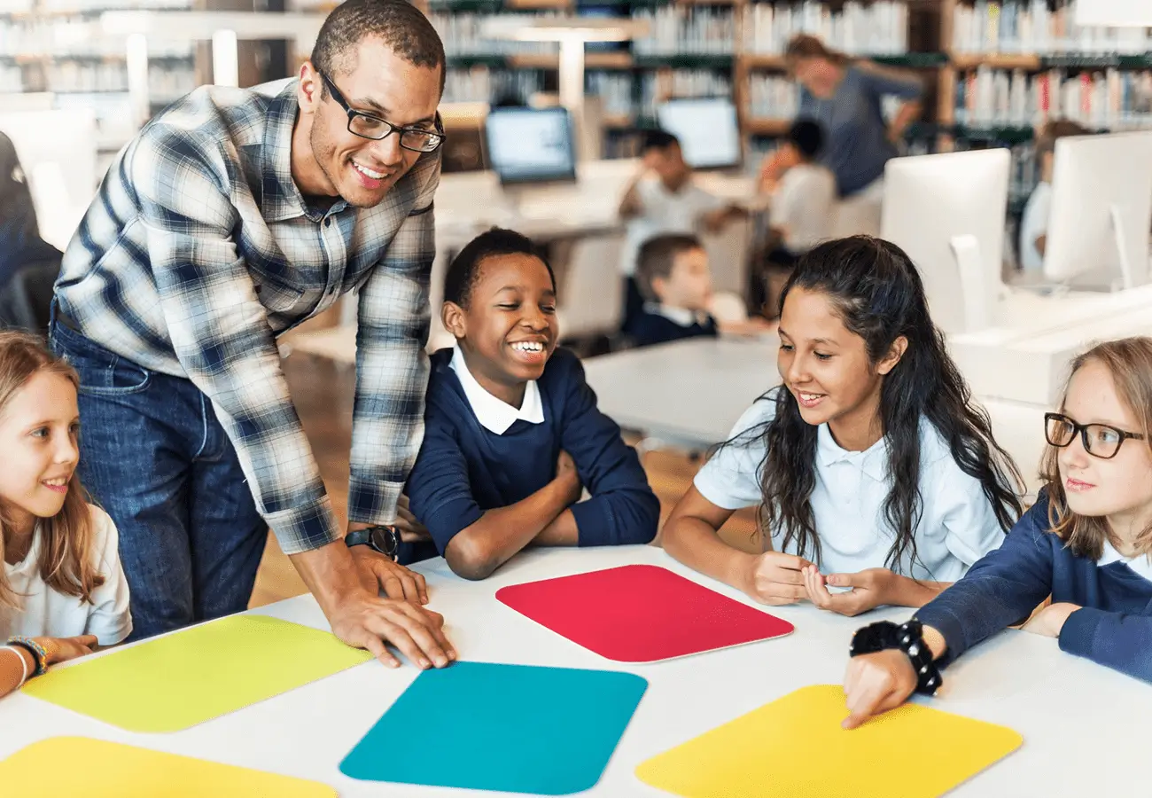 Teacher engaging students in a lively classroom activity